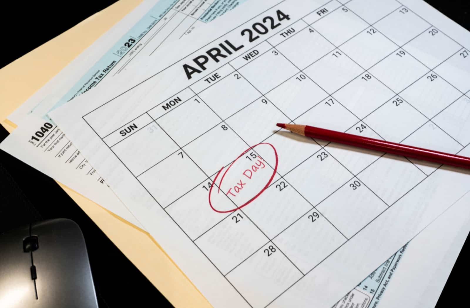 A calendar highlights the deadline for tax submissions.